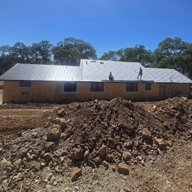 Metal roof installation on a new residential structure