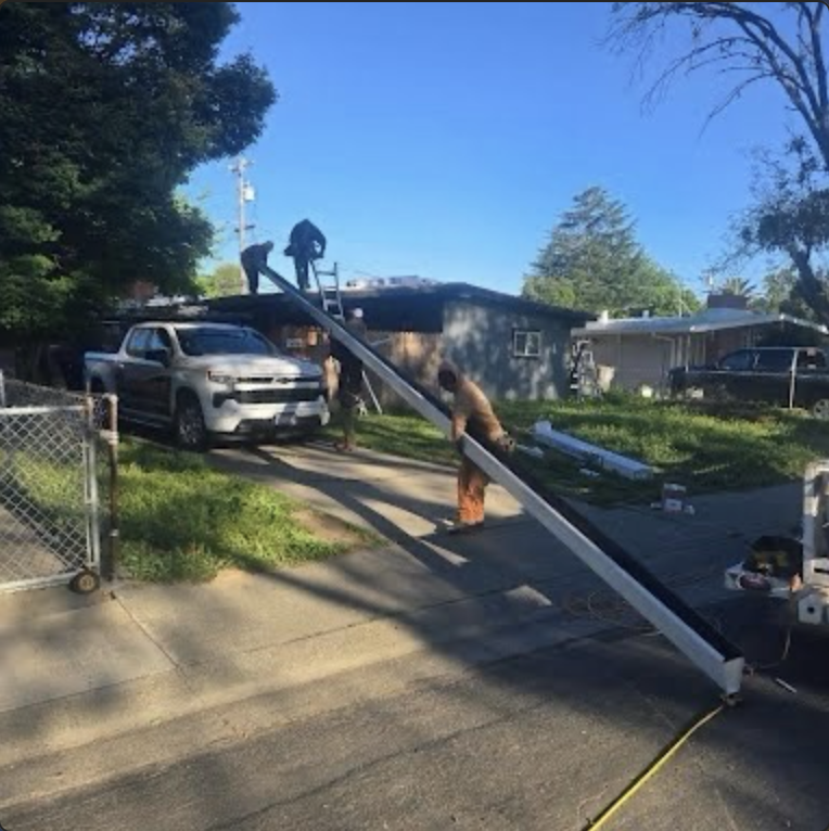 Crew installing gutter and exterior roofline components