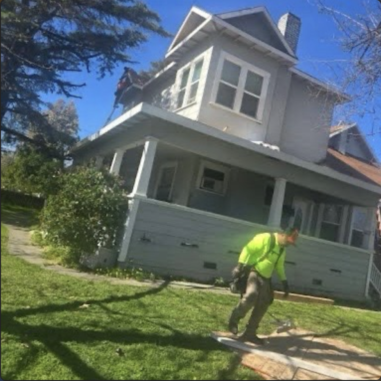 Roofing crew working on a historic style residential home